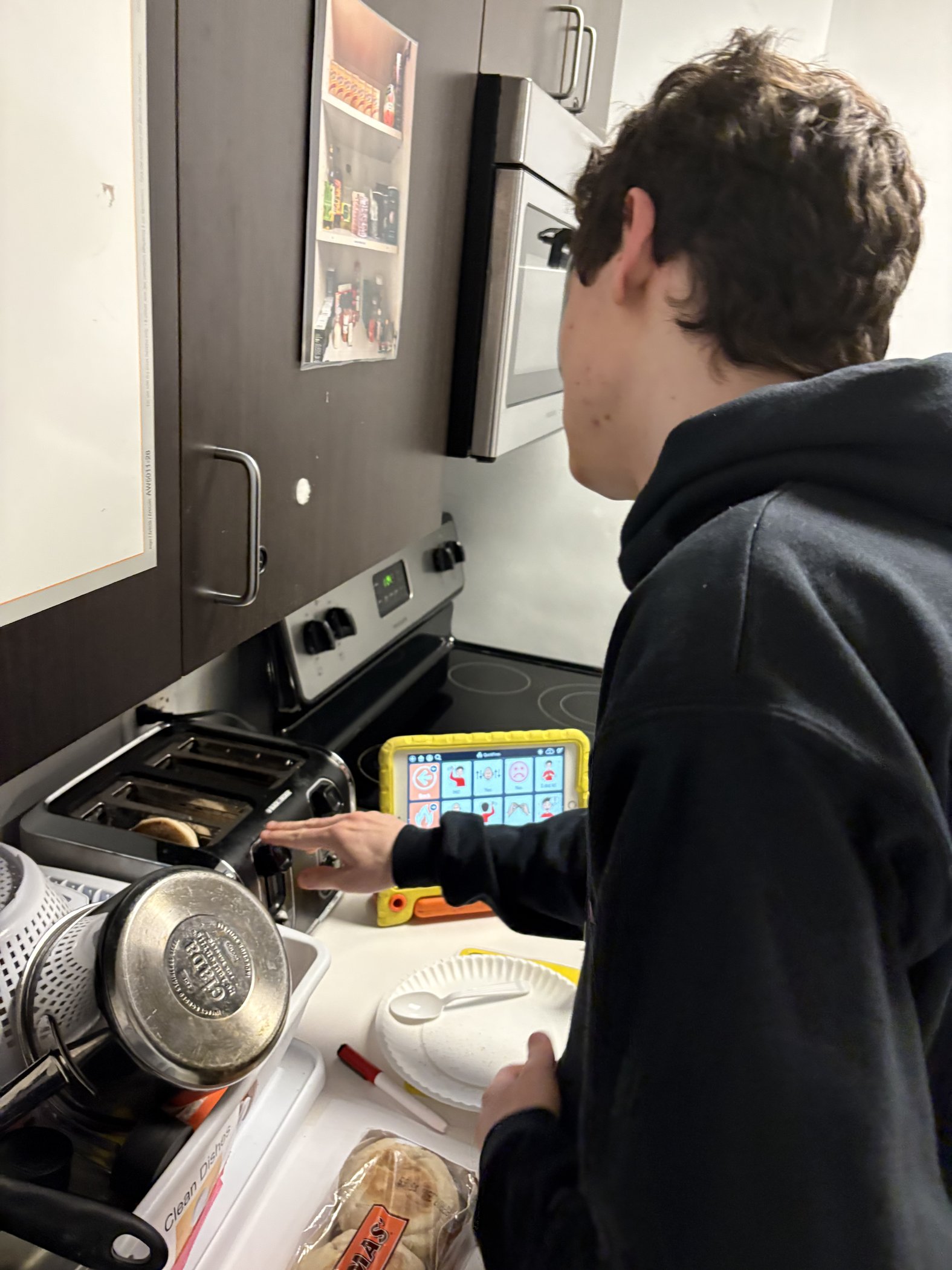 Student practicing life skills in the mock apartment